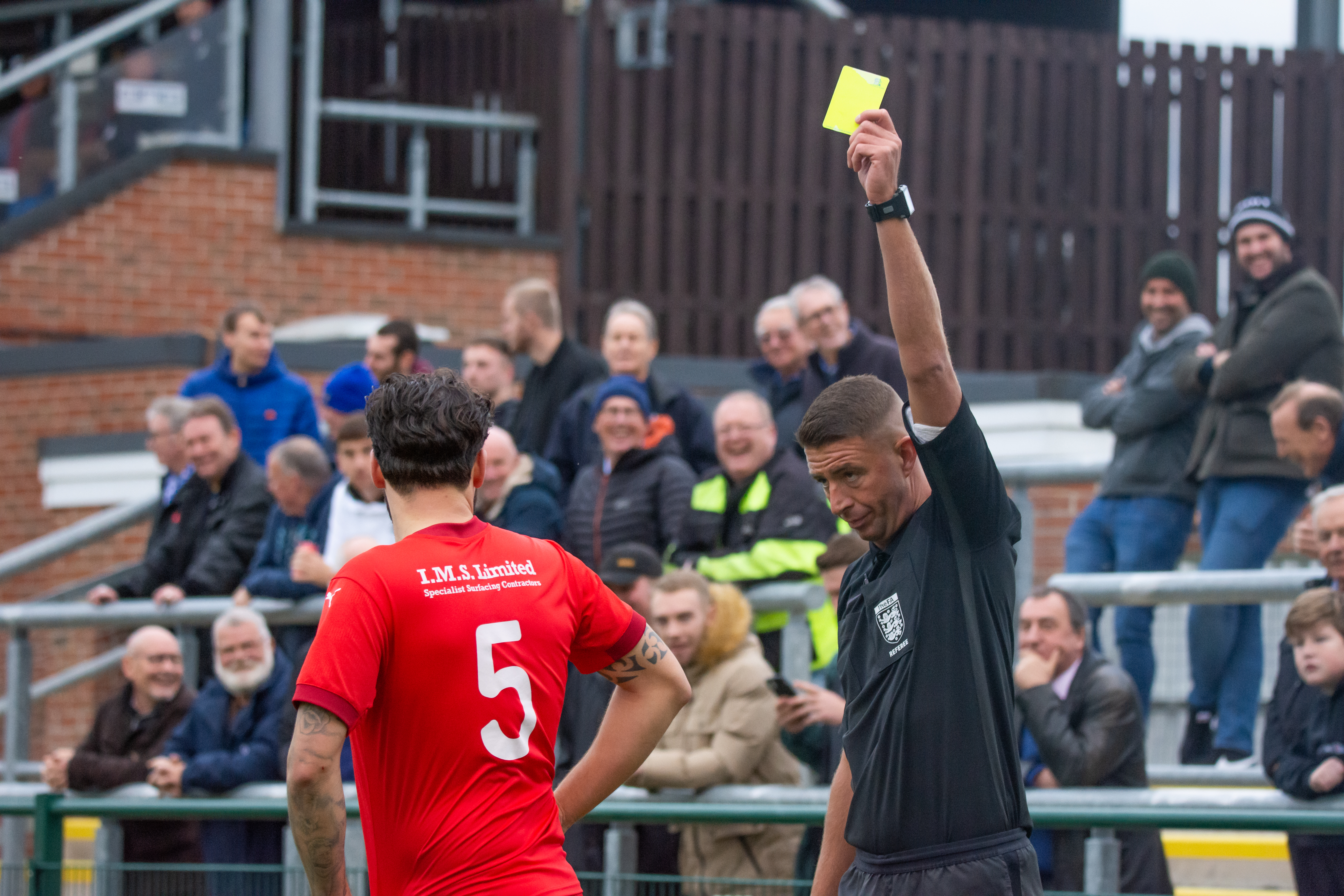 Yellow Card_Marcus Mapstone_Frome Town_FATrR1_13Nov21.jpg